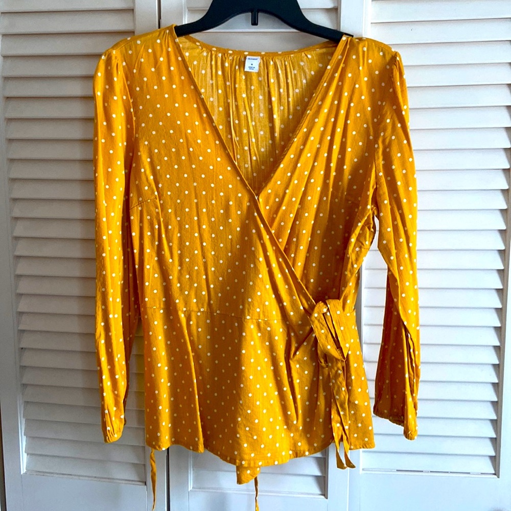 Yellow and white polka dotted tie shirt